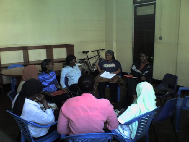 Florence addresses some of the team members during a planning meeting