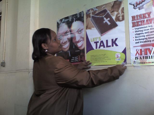 Florence putting up posters