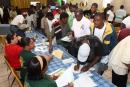 Participants make enquiries at various business booths at the “All Male Empowerment Seminar and Job Fair” hosted by the Kemp Road Urban Renewal Centre and Church of God of Prophecy Life Transformation Centre on Saturday [2/February/2008].