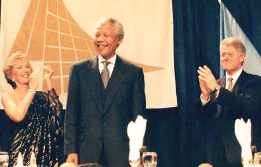 Previous Laureate Nelson Mandela with Bill Clinton and Joan Holmes