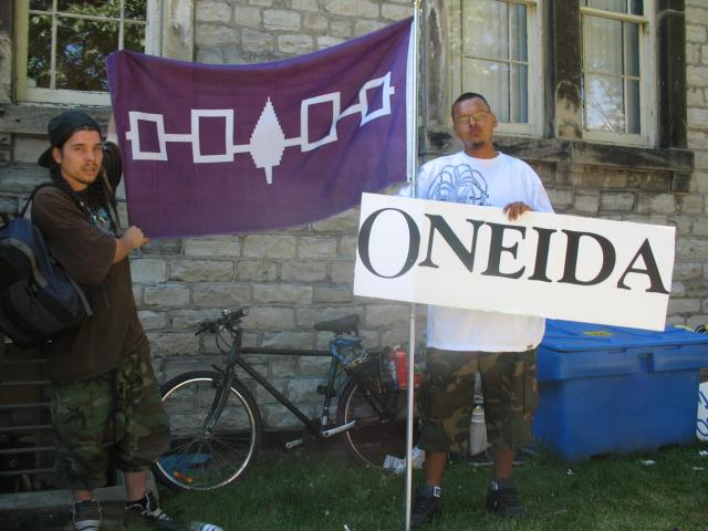 A couple of Aboriginal brothers represent.  They hold a 6nations flag, however only 5 of the 6nations are  represented on the flag as one nation joined later.  (the brother on the right is Oneida)