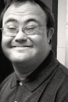 Smiling youth with Down Syndrome